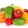 Fresh colorful bell peppers. Isolated on white background